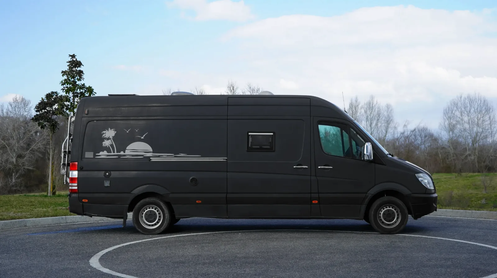 Mercedes-Benz Sprinter campervan in side profile on tarmac