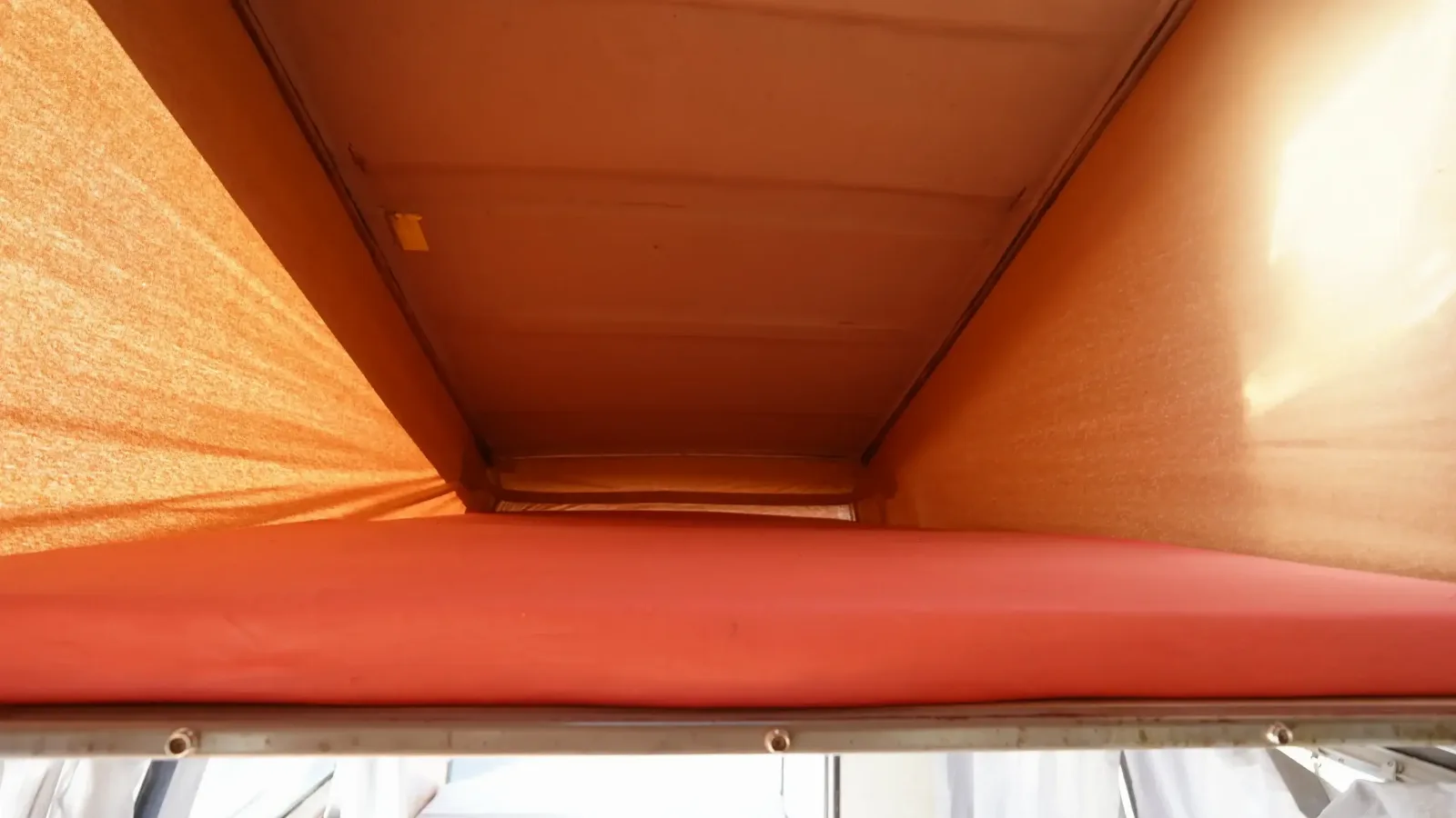 Bunk under the raised pop-top roof of the Volkswagen Westfalia campervan